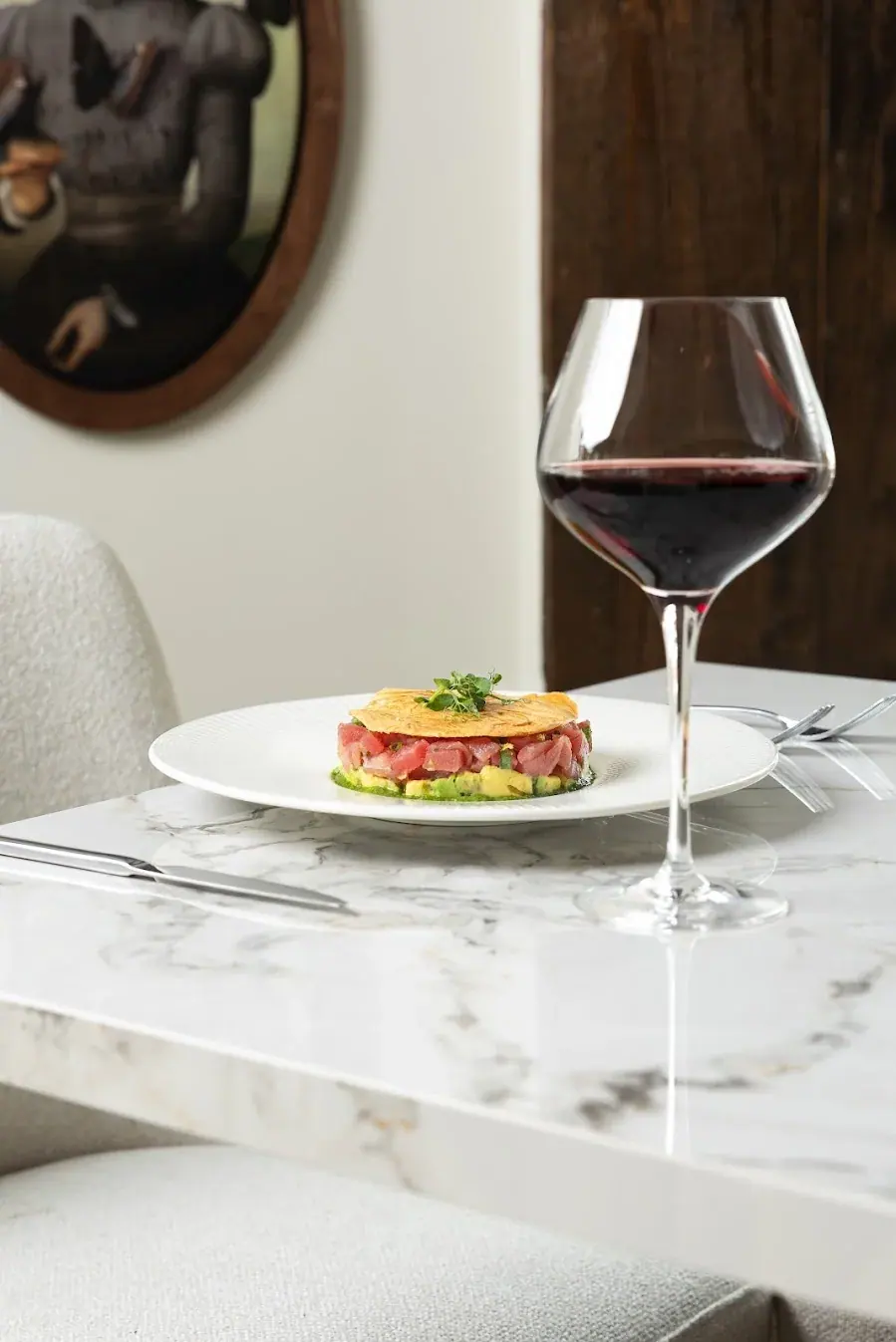 A glass of red being poured