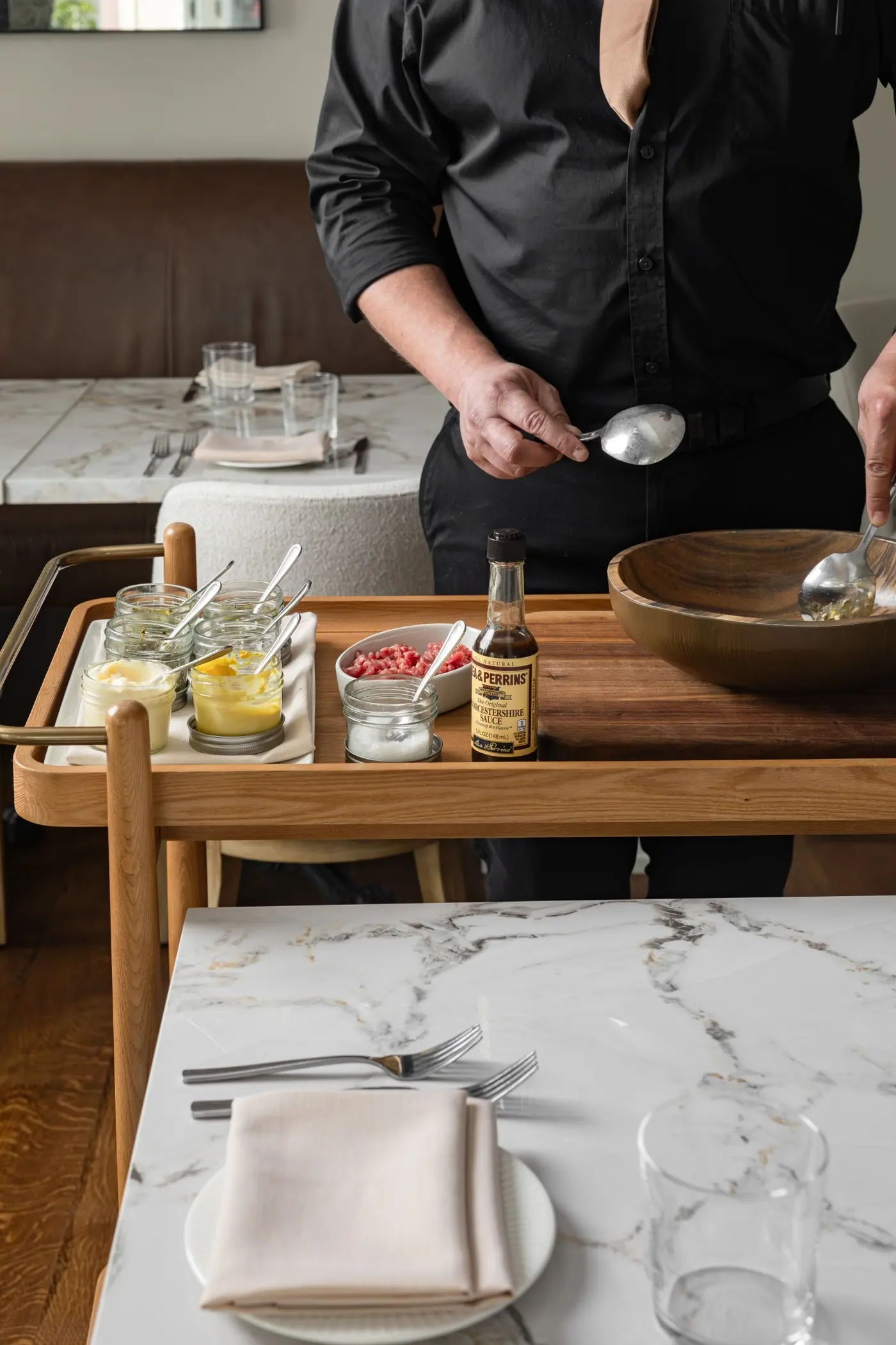 A server working the tableside cart