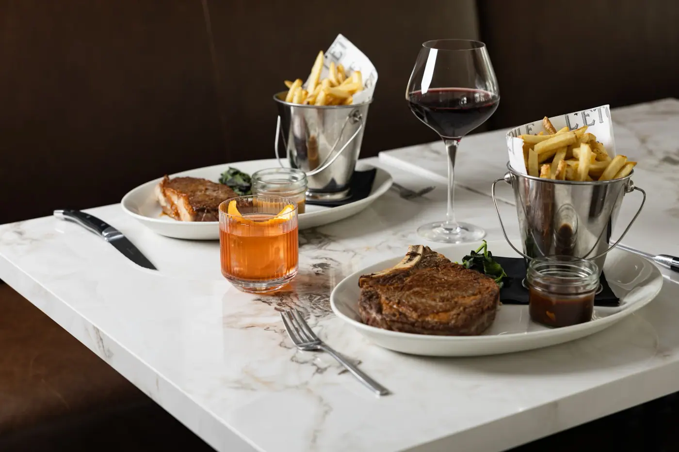 Steak and frites on a marble table